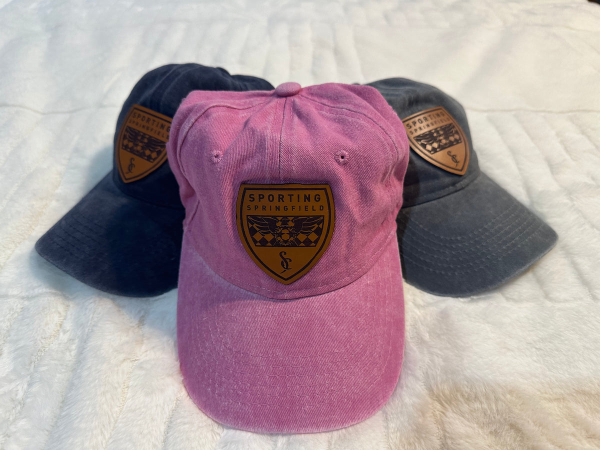 Hat with leather shield
