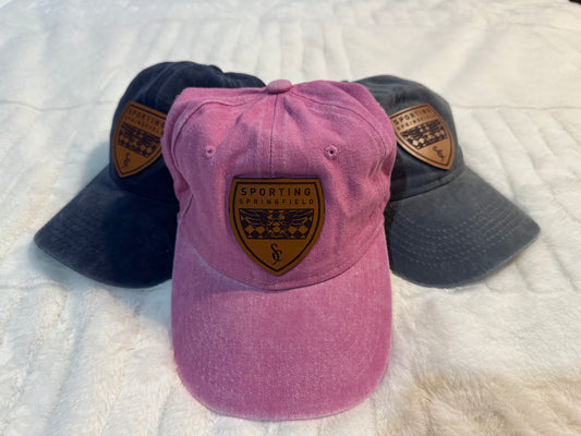 Hat with leather shield